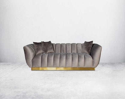 This gorgeous neo-classic 3 seater sofa is upholstered in high-quality velvet fabric with a vertical quilted backrest that accentuates simplicity and comes with 6 beautiful cushions to compliment.