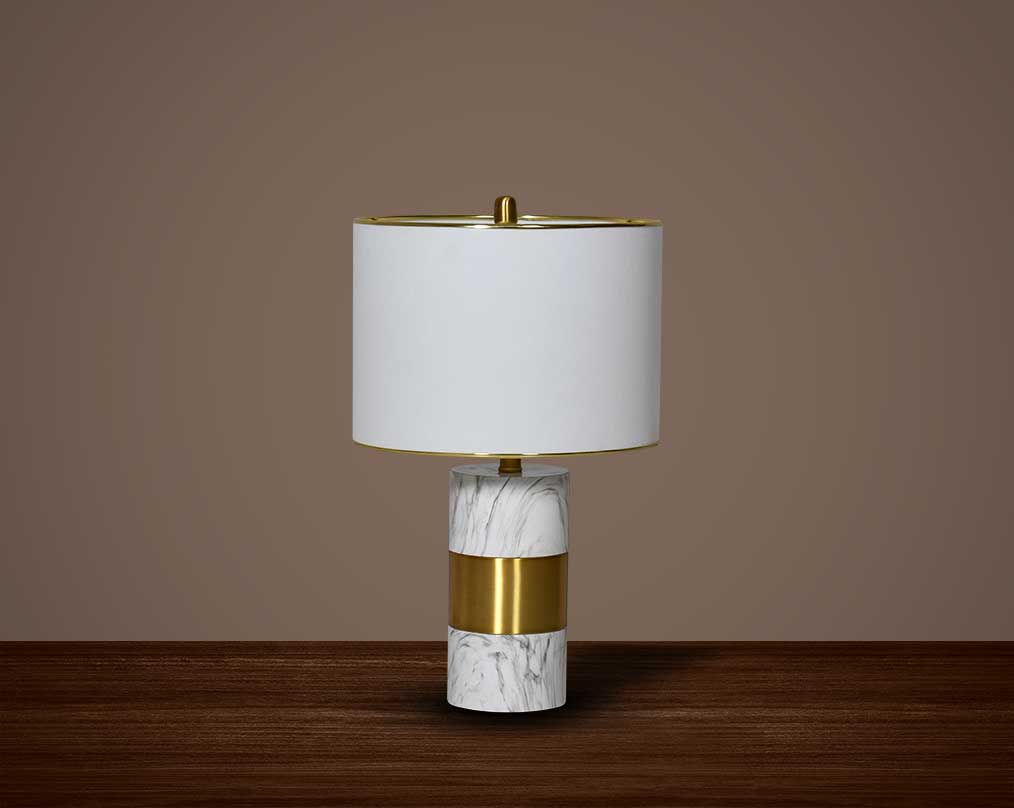 Illuminate your home with this table lamp in gold plated metal & marble base.