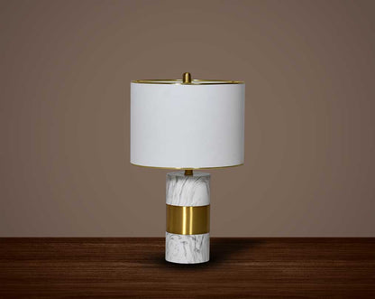 Illuminate your home with this table lamp in gold plated metal & marble base.