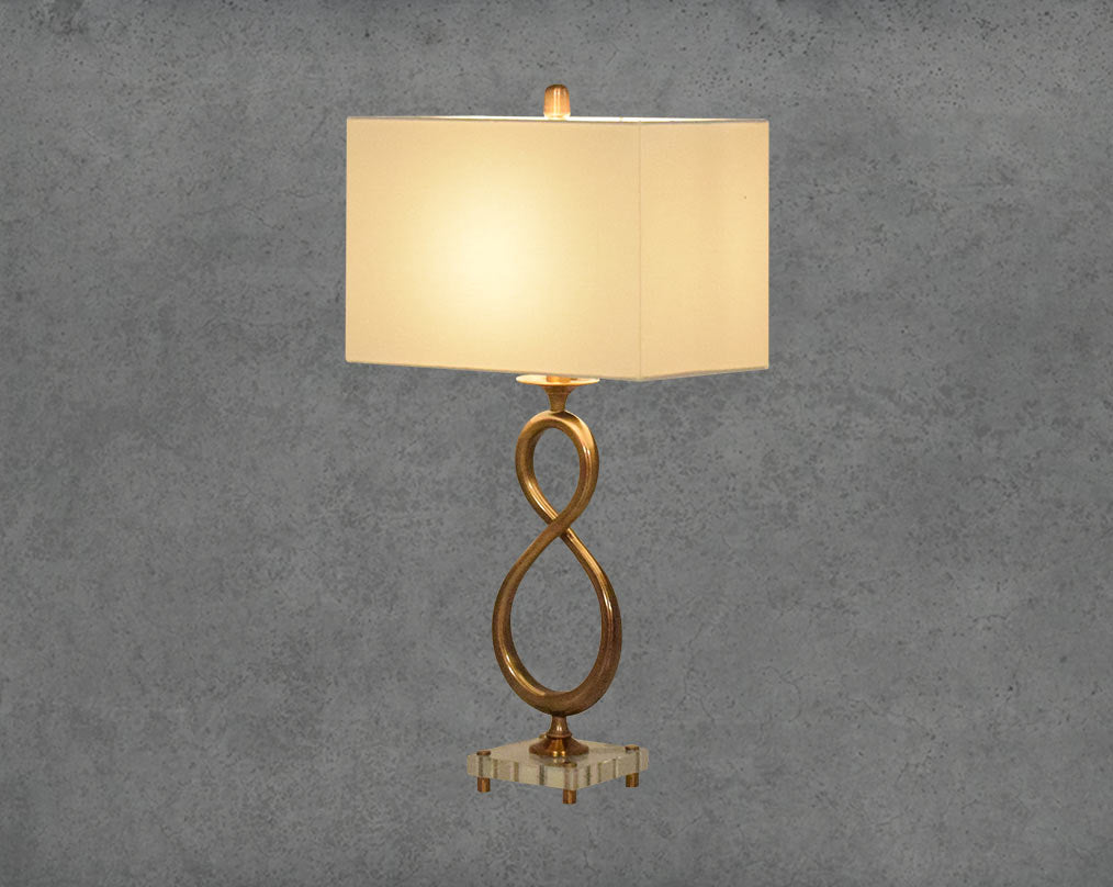 Table lamp in decorative metal and crystal base with translucent fabric shade