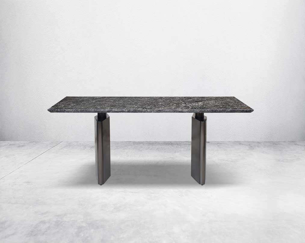 This 6 & 8 seater minimalistically designed dining table with grey marble top is an embodiment of contemporary chicness. This dining table in geometrical hexagonal base comes in glossy gunmetal finish in a contemporary design.