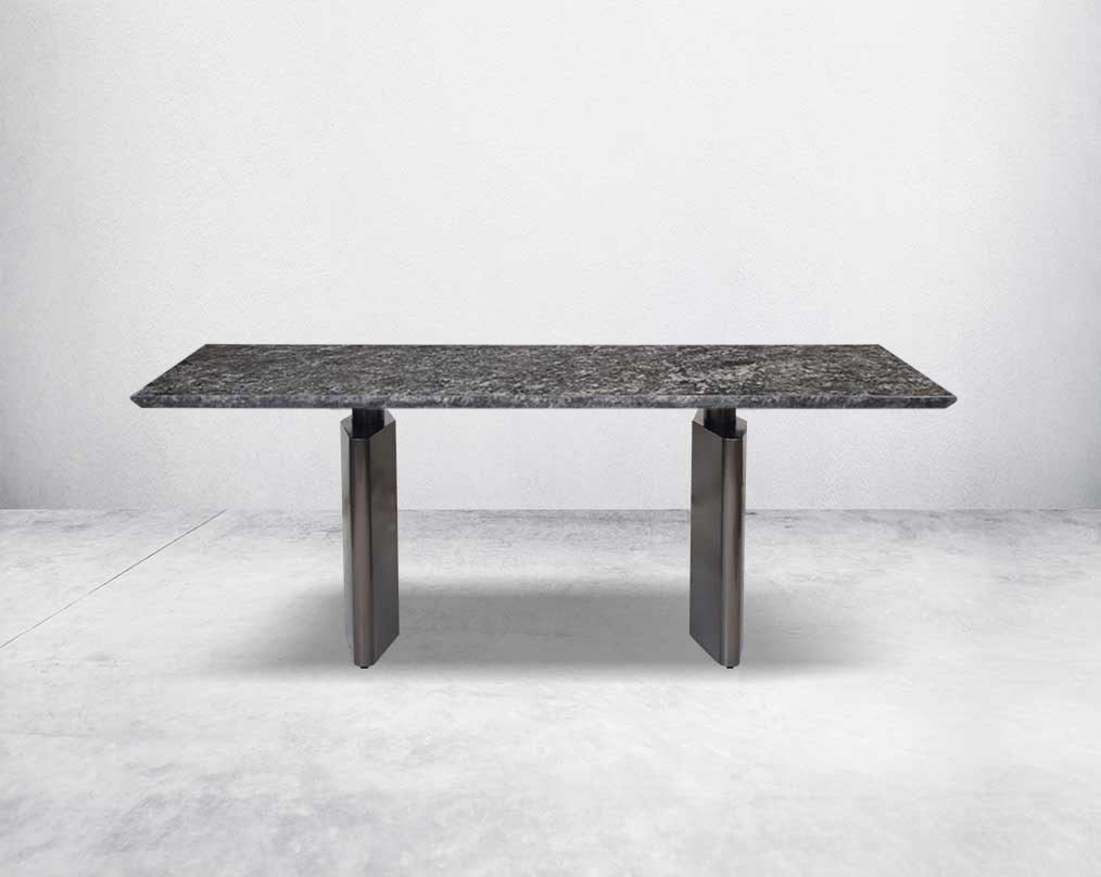 This 8-seater minimalistically designed dining table with grey marble top is an embodiment of contemporary chicness