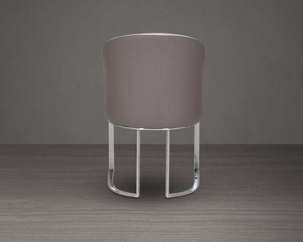 This dining chair back with stands resplendent with a rich contemporary look. It is crafted in faux leather upholstery and comes in two colours with glossy, silver-plated, stainless steel legs