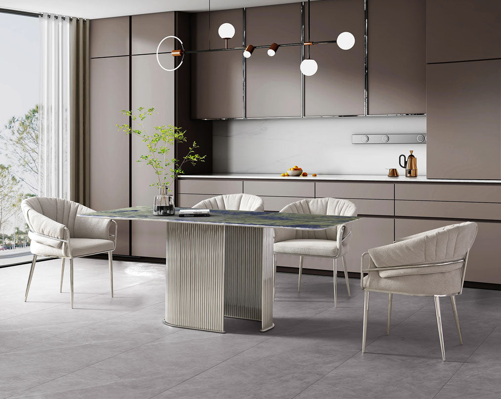 This predominantly eclectic and contemporary dining chair is upholstered in boucle fabric with glossy stainless steel frame & legs which is perfect around any dining table.