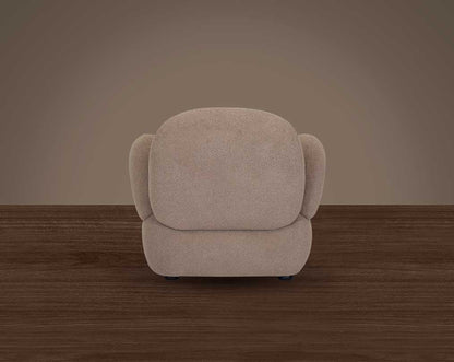 This sinuous & soft 1 seater sofa exudes a sense of calm & ease, upholstered in high-quality boucle fabric with wooden legs back view