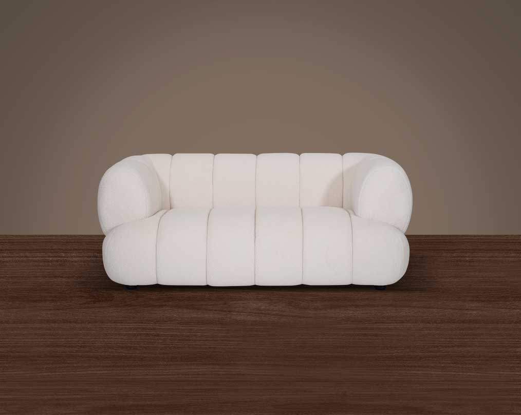 This sinuous & soft 2 seater sofa exudes a sense of calm & ease, upholstered in high-quality boucle fabric with wooden legs front view