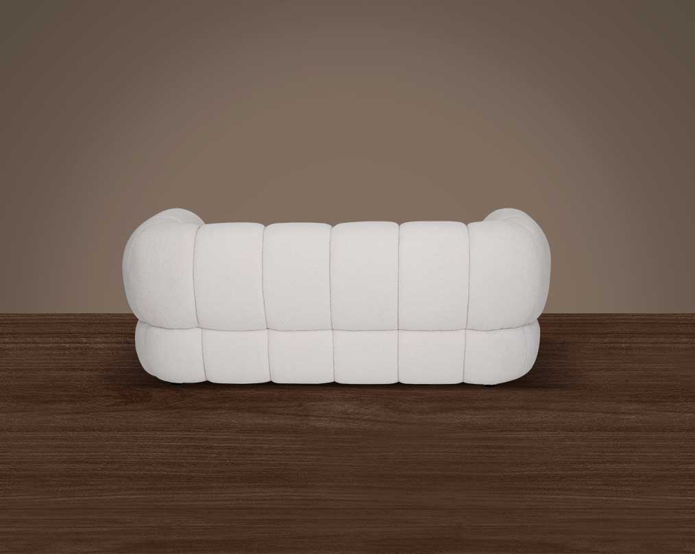 This sinuous & soft 2 seater sofa exudes a sense of calm & ease, upholstered in high-quality boucle fabric with wooden legs back view