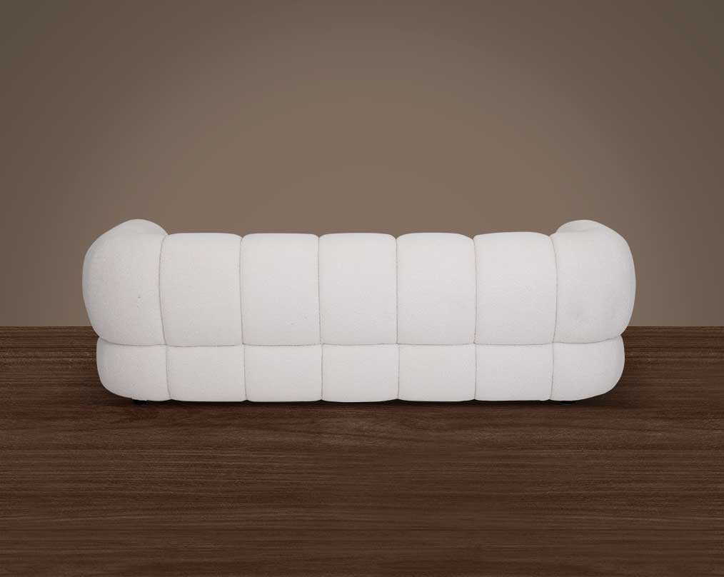 This sinuous & soft 3 seater sofa exudes a sense of calm & ease, upholstered in high-quality boucle fabric with wooden legs back view