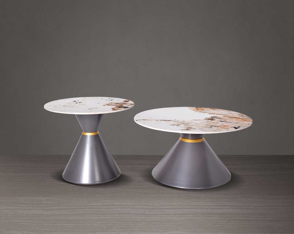 This round coffee table is a captivating composition of a round white & brown ceramic top & conical metal base