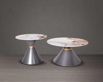 This round coffee table is a captivating composition of a round white & brown ceramic top & conical metal base