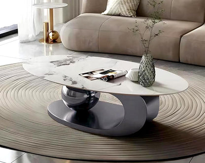 This oval white sintered stone coffee table with a ball & tubular stainless steel titanium finished base brings a rich contemporary luxurious style to any living room.