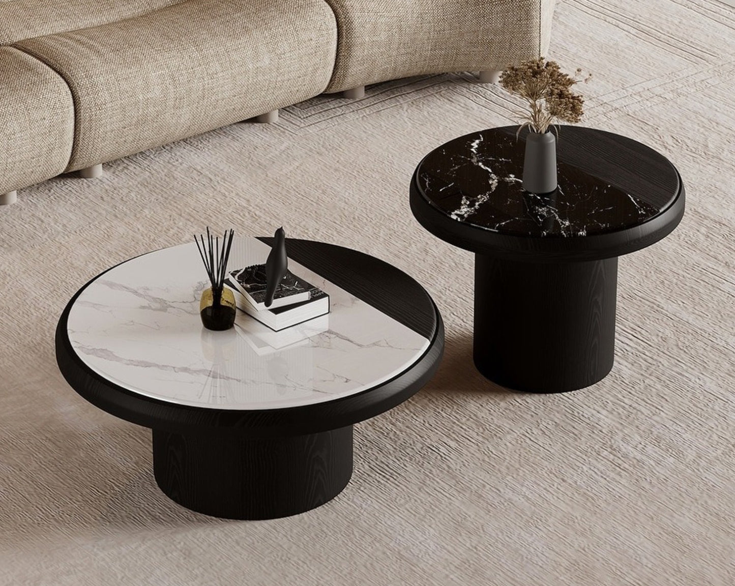 Two modern coffee tables with marble and black finishes in a living room setting.