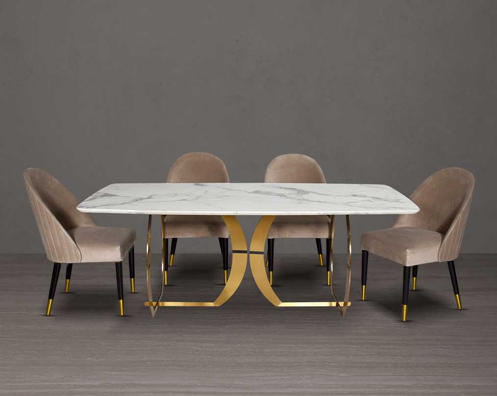 This beautiful & delicate 6 & 8 seater marble dining table is crafted to perfection. It is cast with a natural white a cursive artful base in matt gold plated stainless steel. "Minimalistically designed chair with wooden legs for enhanced durability. it i