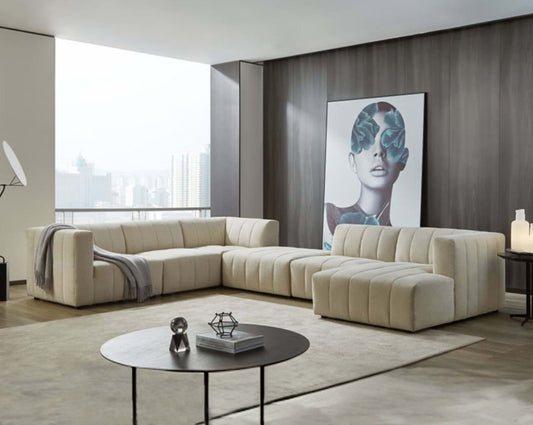 The L shaped modular sofa comes upholstered in regal beige fabric with vertical channel quilting & an ottoman to compliment with living room.