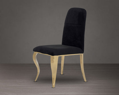 Dining chair upholstered in fabric with gold plated stainless steel legs.