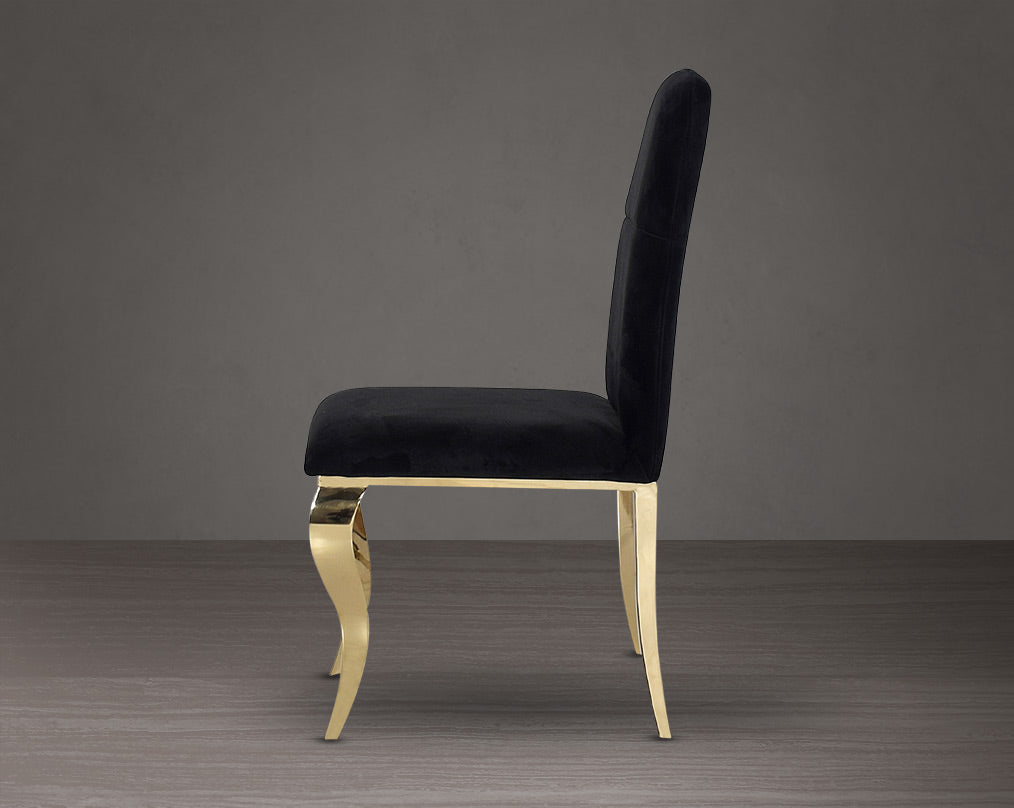 Dining chair upholstered in fabric side view  with gold plated stainless steel legs.