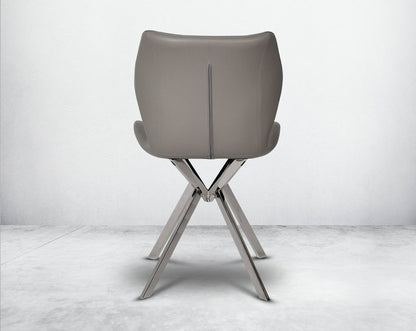 Dining chair upholstered in faux leather with stainless steel legs back view