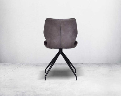 This soft, cushioned dining chair back  features an extraordinary contemporary design with tufted back and cushioned seat with metal legs