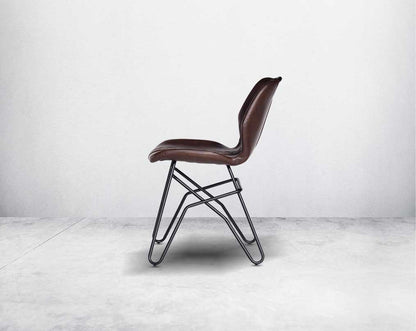 This soft, cushioned dining chair features an extraordinary contemporary design with tufted back and cushioned seat with metal legs.