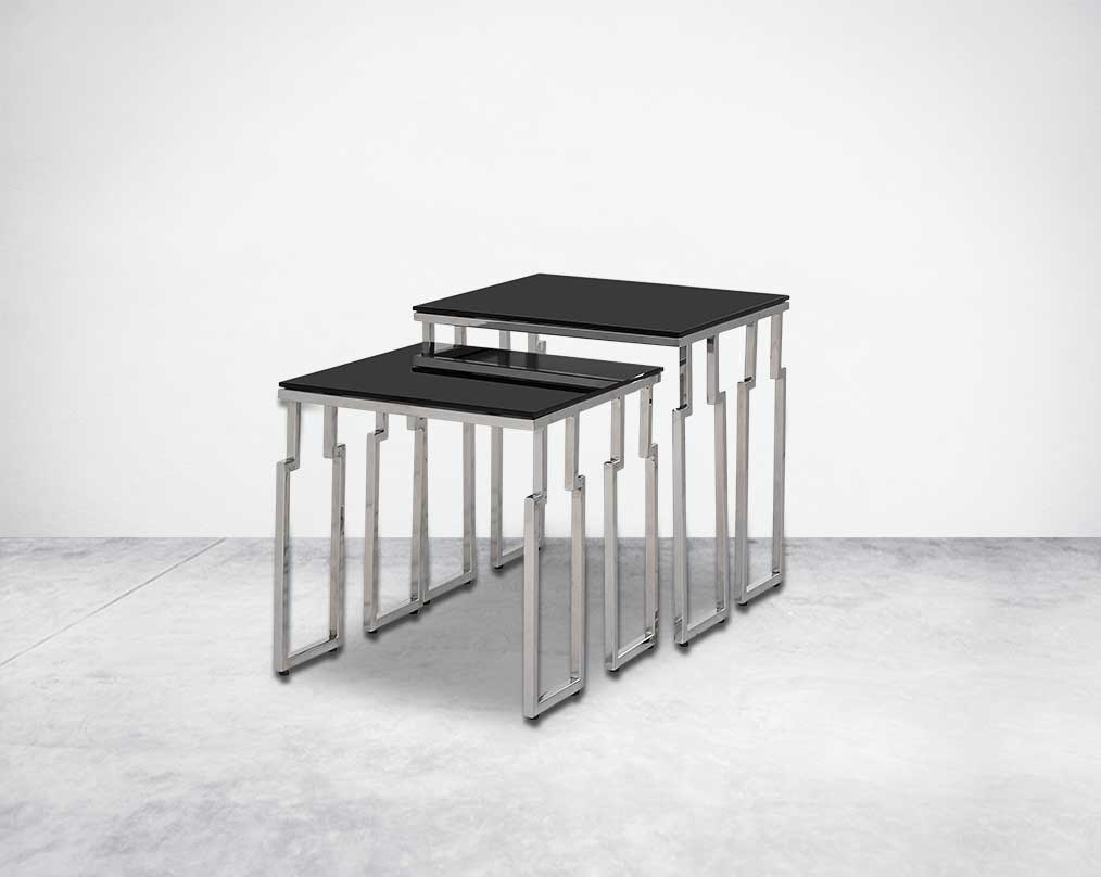Nested tables in a set of 2 with black tempered glass top and high polished stainless steel base in rich contemporary design side view