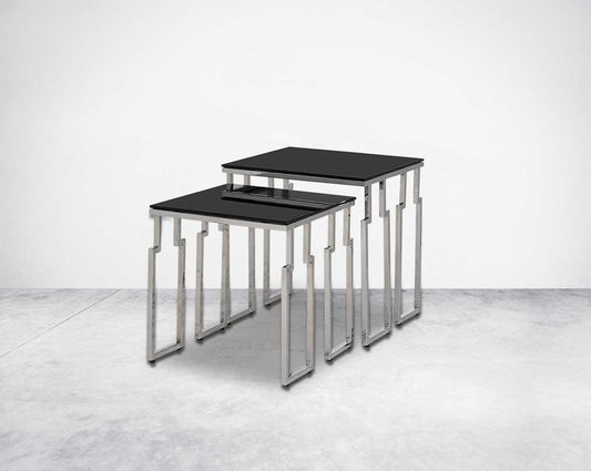 Nested tables in a set of 2 with black tempered glass top and high polished stainless steel base in rich contemporary design side view