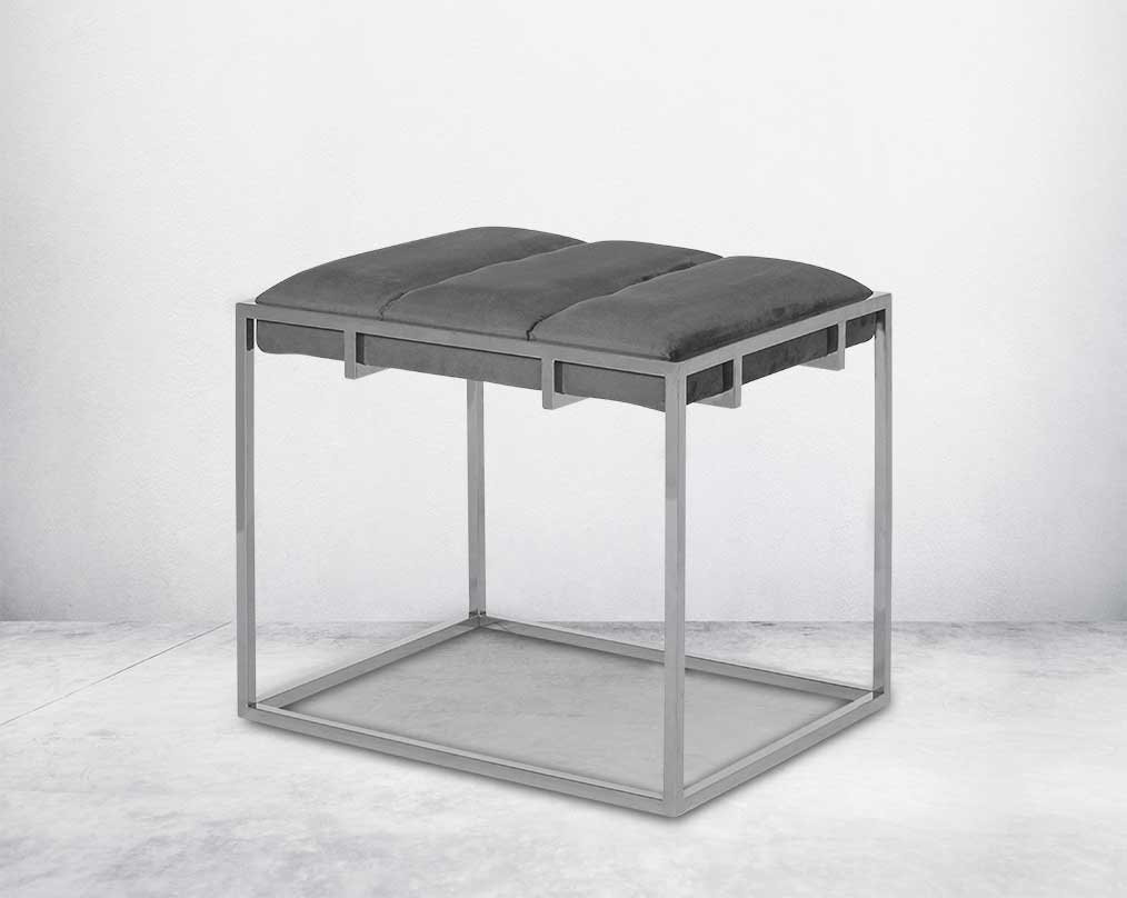 Ottoman upholstered in fabric with high polished stainless steel frame and legs side view