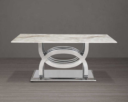 8 seater rectangular dining table with marble top comes with an artful stainless steel base.