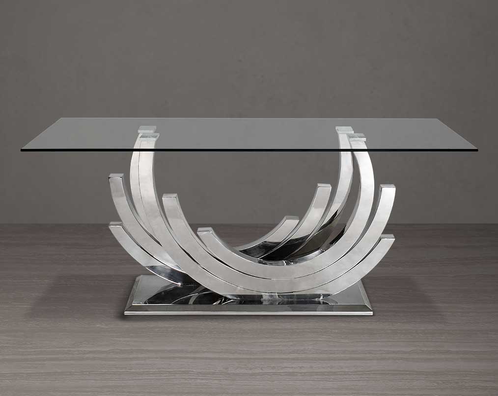 This 6 & 8 seater dining table with clear tempered glass top comes with an artful abstract stainless steel base.The stainless steel base echoes an opulent and sophisticated modern style and stands out in any ambience.