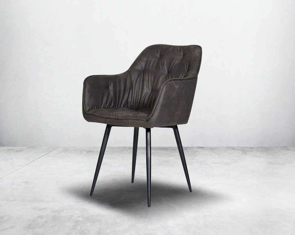 This soft, cushioned dining chair features an extraordinary contemporary design with tufted back and cushioned seat with metal legs.