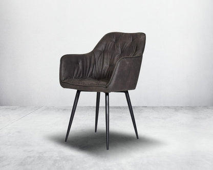 This soft, cushioned dining chair features an extraordinary contemporary design with tufted back and cushioned seat with metal legs.