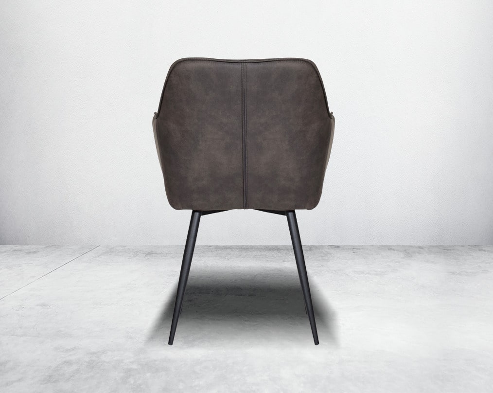 This soft, cushioned dining chair features an extraordinary contemporary design with tufted back and cushioned seat with metal legs back view