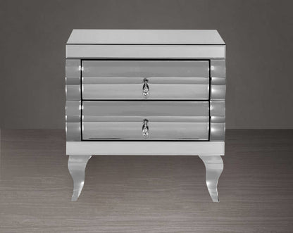 Bedside table with closed drawer  in silver curved mirror with legs in stainless steel.
