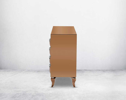 Chest of drawers in curved tawny mirror with rose gold plated stainless steel legs side view.