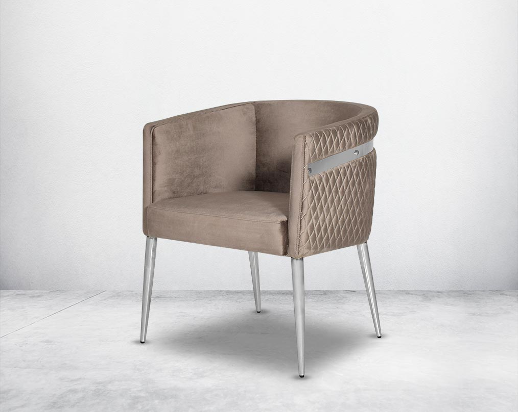 Accent leisure armchair upholstered & quilted in luxurious velvet fabric with high polished stainless steel frame and legs.