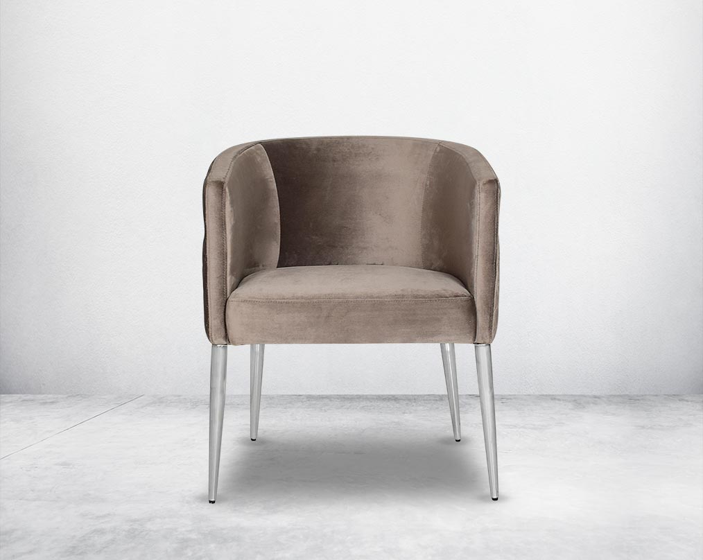 Accent leisure armchair front  upholstered & quilted in luxurious velvet fabric with high polished stainless steel frame and legs.