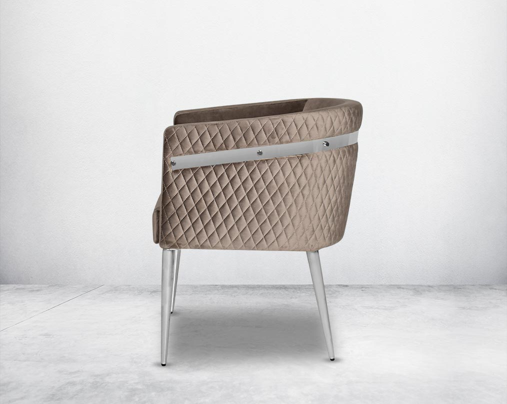 Accent leisure armchair back  upholstered & quilted in luxurious velvet fabric with high polished stainless steel frame and legs.