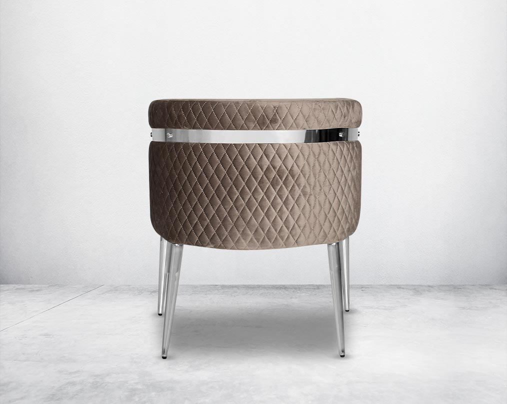 Accent leisure armchair behind  upholstered & quilted in luxurious velvet fabric with high polished stainless steel frame and legs.