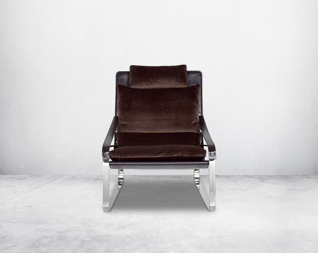 Leisure chair  front upholstered in fabric with high polished stainless steel frame.