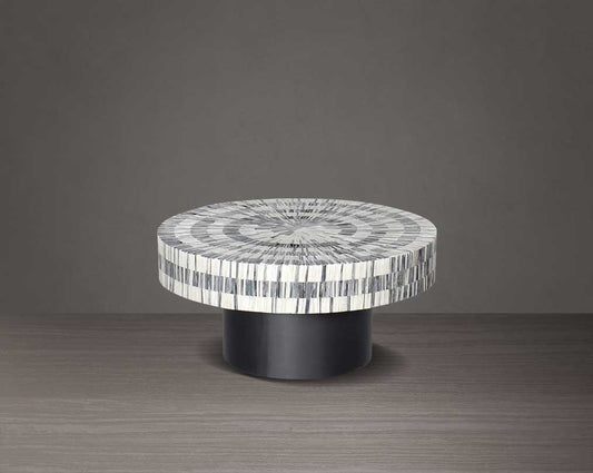 This gorgeous antique black and white inlay coffee table with a black metal base is a perfect statement piece in your living room - small