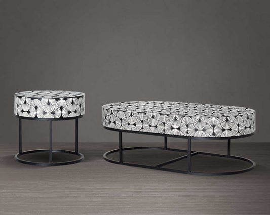 This gorgeous black and white inlay coffee and end table in floral pattern with a black metal base is a perfect statement piece in your living room.