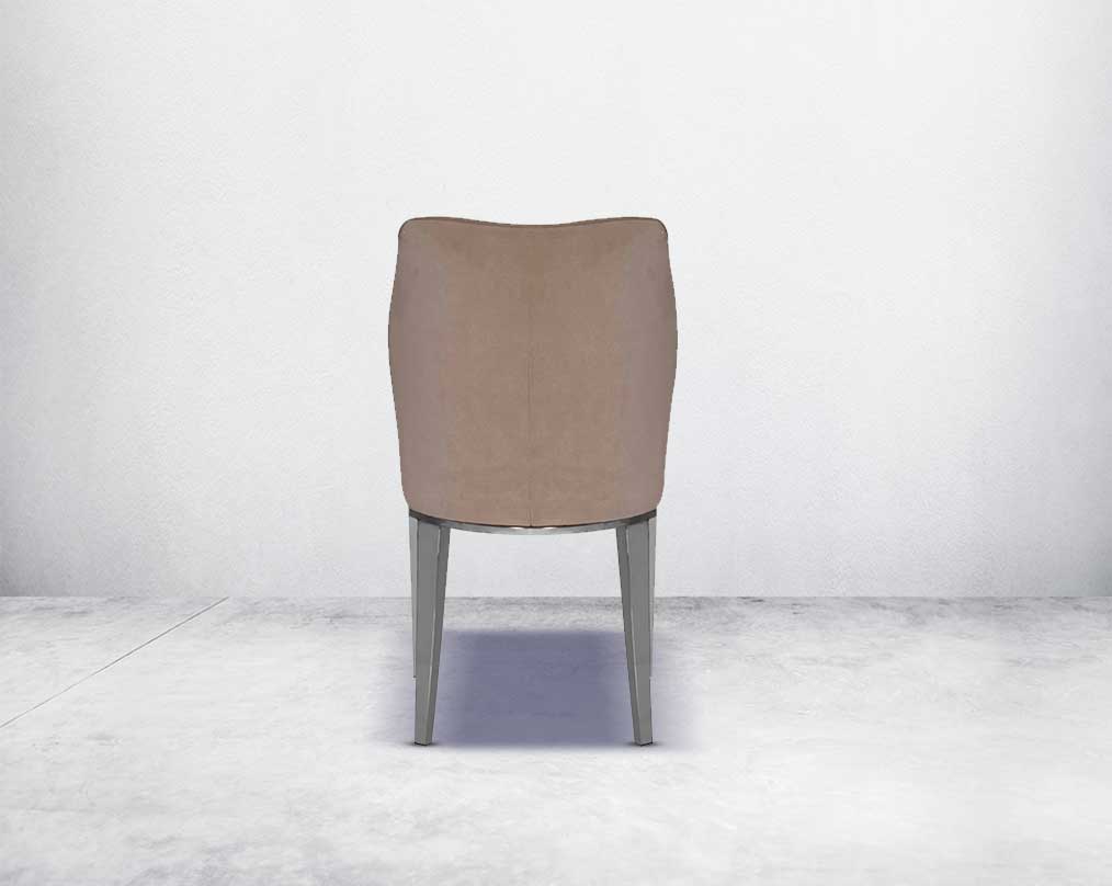 Dining chair back with  upholstered in velvet fabric with high polished stainless steel legs.