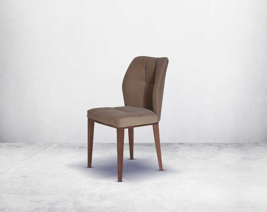 Dining chair upholstered in velvet fabric with high polished rose gold stainless steel legs.