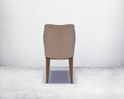 Dining chair upholstered in velvet fabric  back with high polished rose gold stainless steel legs.