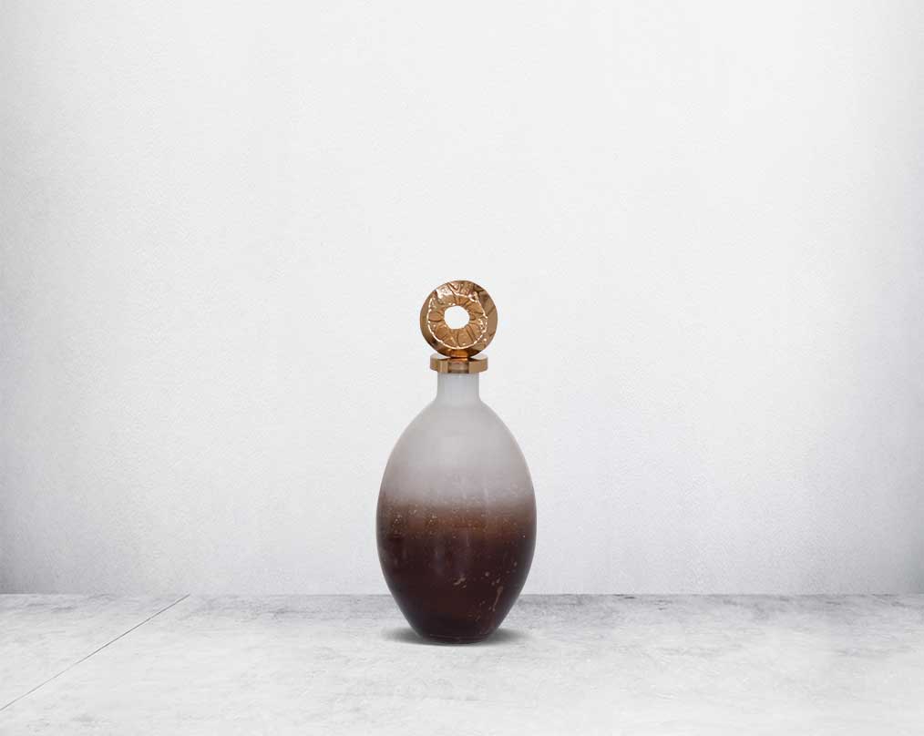 Decorative bottle in champagne & teak crust tinted lustre glass with ornamental antique gold plated aluminium lid.  small