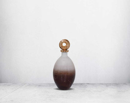 Decorative bottle in champagne & teak crust tinted lustre glass with ornamental antique gold plated aluminium lid.  small