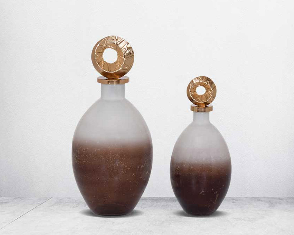 Decorative bottle in champagne & teak crust tinted lustre glass with ornamental antique gold plated aluminium lid.-1bottle large 2 bottle small