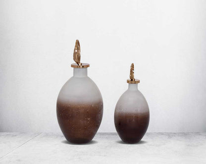 Decorative bottle in champagne & teak crust tinted lustre glass with ornamental antique gold plated aluminium lid.-1bottle large 2 bottle small