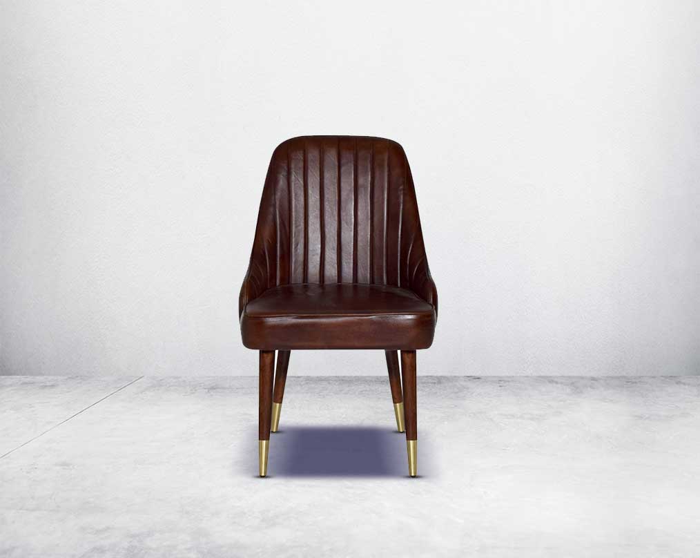 This rich contemporary dining chair in genuine leather makes for a luxurious dining experience It comes with a quilted cushioned back in acacia wood with metal splayed legs.