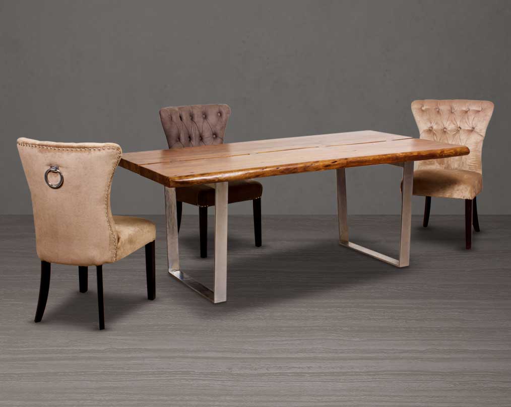 Large 6 seater rectangle dining table in solid acacia wood in light walnut with nickel coated stainless steel base in glossy finish. Dining chair upholstered in fabric with tufted back and birchwood legs.