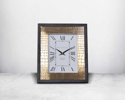 Rectangular table clock in front with  croc etched design in matt antique brass finish & matt black frame with Roman numerals in rich contemporary design.
